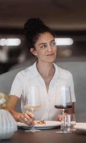 Your hotels in South Tyrol: the home of abundance Couple dining at restaurant with wine and soft lighting