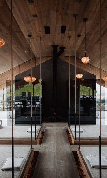 Your hotels in South Tyrol: the home of abundance Modern spa with hanging beds, mirrors, and warm wooden accents