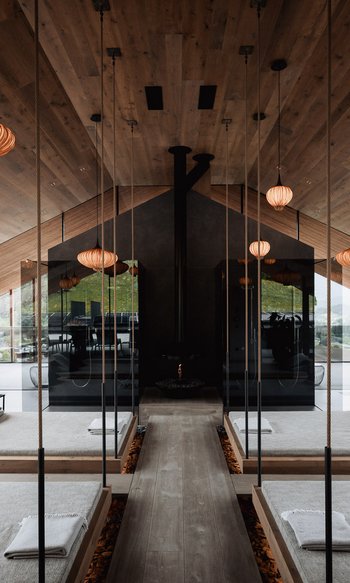 Your hotels in South Tyrol: the home of abundance Modern spa with hanging beds, mirrors, and warm wooden accents